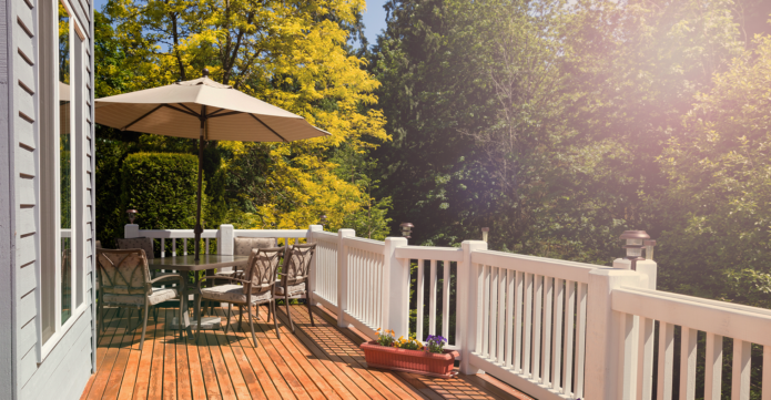 Patio with outdoor table, chairs and umbrella