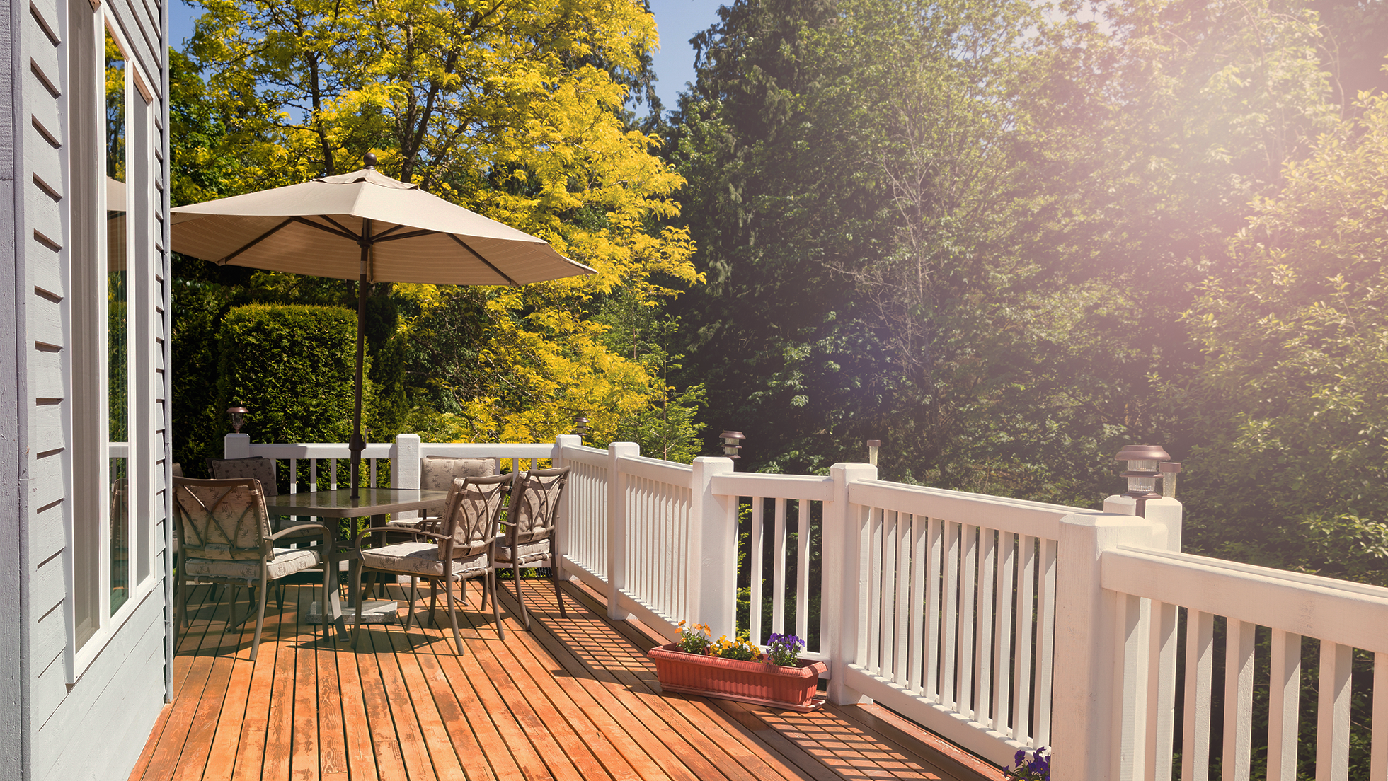 Patio with outdoor table, chairs and umbrella