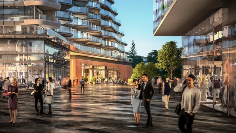 Rendering of modern outdoor retail plaza with glass-front shops and curved residential balconies above, featuring pedestrians walking across a wet stone plaza in soft evening light.