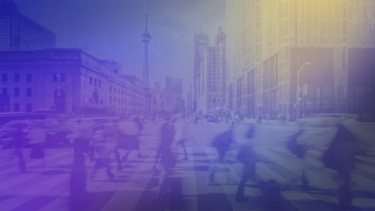 Blurred pedestrians cross a busy downtown Toronto intersection beneath the CN Tower, with modern city buildings and a blue-purple gradient overlay creating a dynamic urban backdrop.