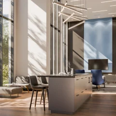 An elegant interior space with high ceilings and seating areas.